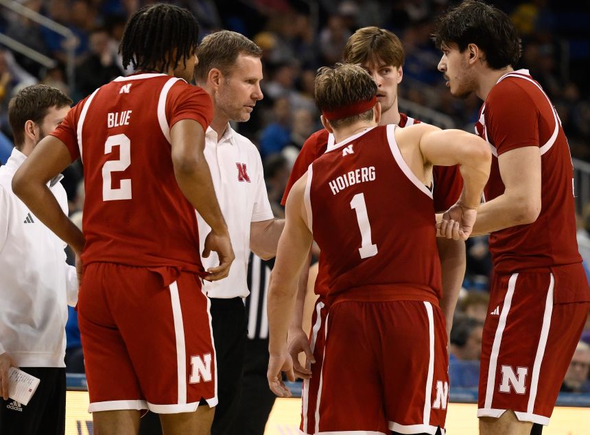 Nebraska head coach Fred Hoiberg talks to his players during a timeout.
