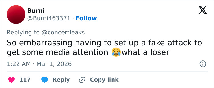 Tweet screenshot criticizing a fake attack claim amidst chaos at Brit Awards as singer gets pushed off stage during performance.