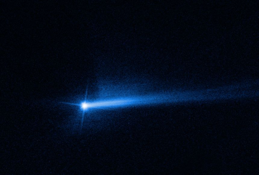 Two tails of dust ejected from the Didymos-Dimorphos asteroid system are seen in new images from NASA's Hubble Space Telescope, documenting the lingering aftermath of the NASA's Double Asteroid Redirection Test (DART) impact.
The DART spacecraft impacted Dimorphos, a small moonlet of Didymos, on Sept. 26 in a planetary defense test to change Dimorphos' orbit by crashing into it.
Repeated observations from Hubble over the last several weeks have allowed scientists to present a more complete picture of how the system's debris cloud has evolved over time. The observations show that the ejected material, or 