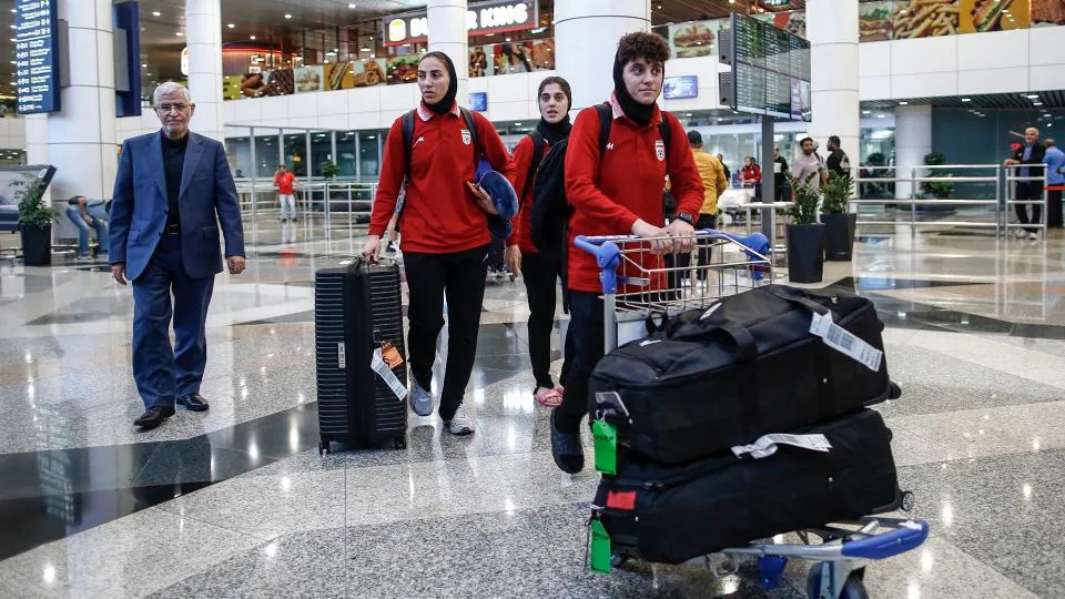 Members of Iran's women's soccer team arrive at the Kuala Lumpur International Airport - Arif Kartono/AFP/Getty Images