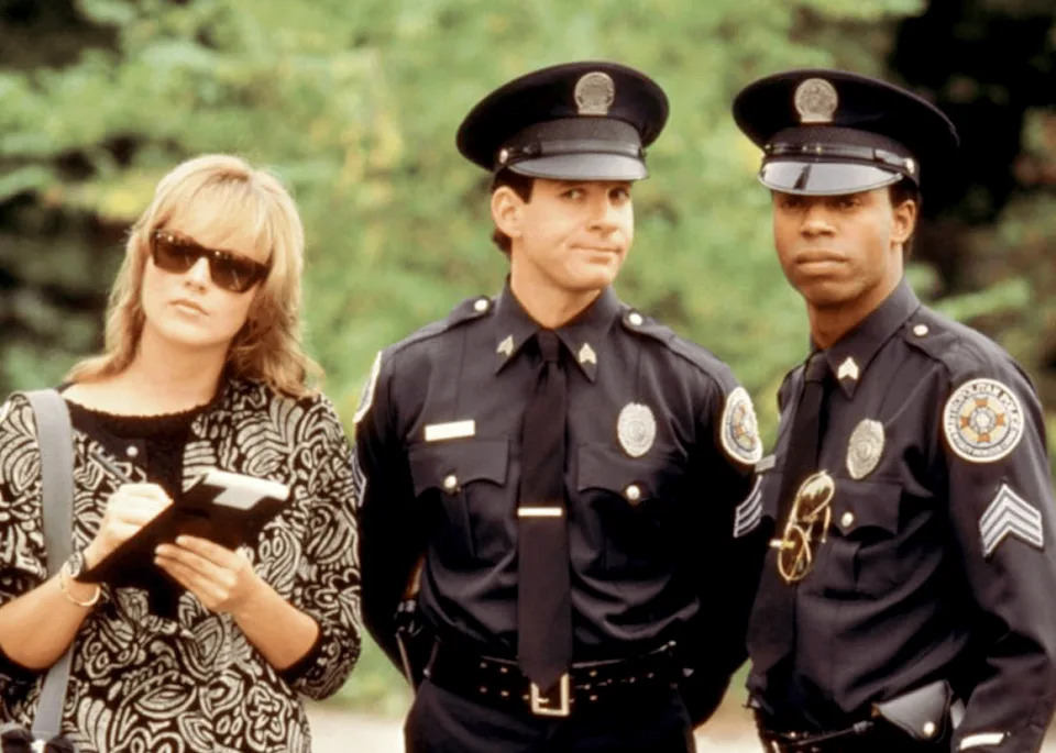 Sharon Stone, Steve Guttenberg, and Michael Winslow in ‘Police Academy 4: Citizens on Patrol’. -