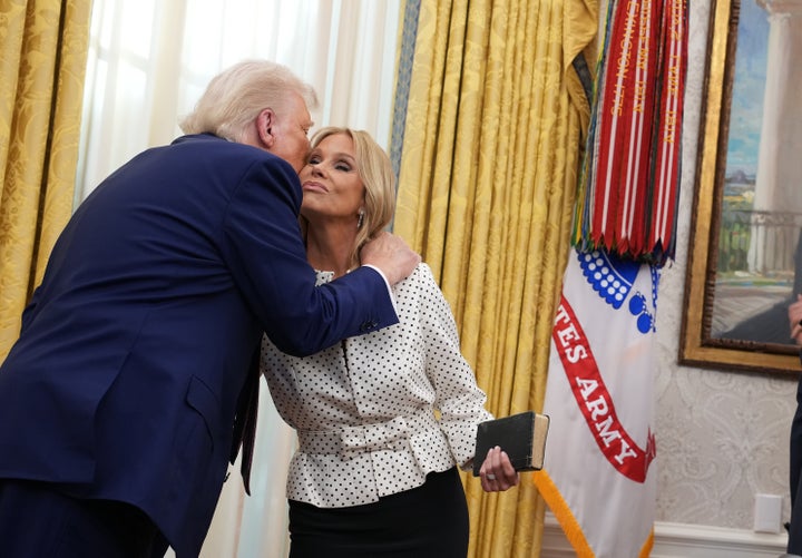 President Donald Trump embraces Hines after Kennedy was sworn in as secretary of health and human services in the Oval Office at the White House on Feb. 13, 2025.