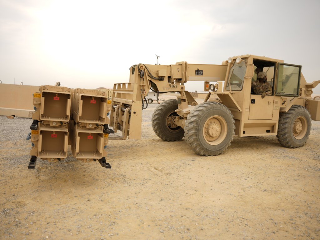 A U.S. Army Soldier, assigned to 1-43 Air Defense Artillery Regiment (ADAR), operates a forklift bearing MIM-104 Patriot Surface-to-Air Missile (SAM) cannisters during a guided-missile transporter reload certification on October 25, 2023 at an undisclosed location in the CENTCOM Area of Operations. This training will increase the operator and team’s proficiency and ability to work in austere environments. (U.S. Army Photo by Capt. Nick Beavers)