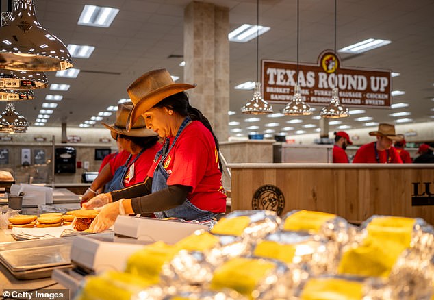 Employees in bright red shirts hustle between counters that often outnumber those in a supermarket