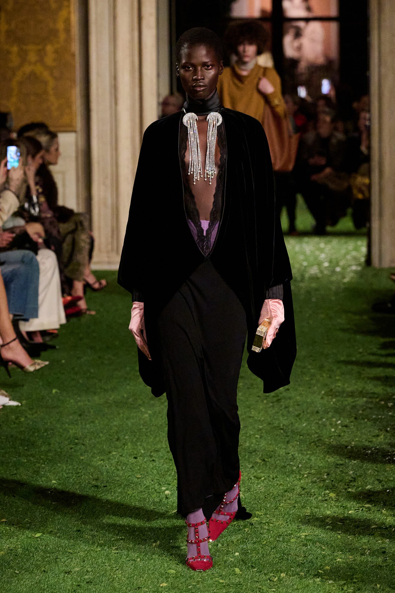 fashion model walking the runway in a stylish outfit