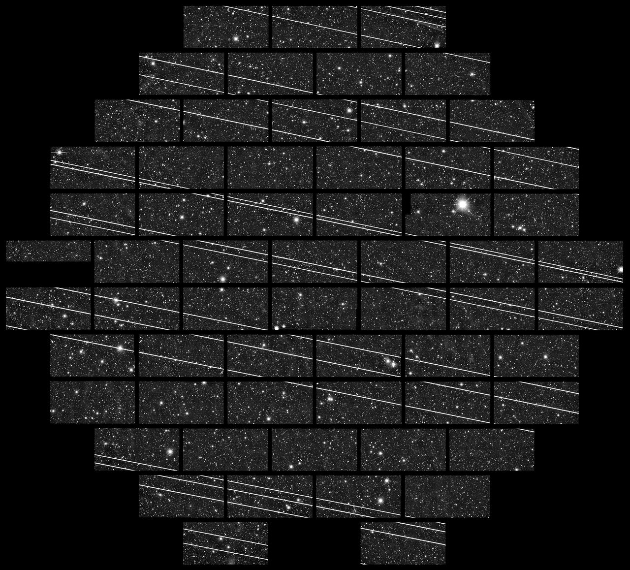A telescope image of the sky with tons of white streaks across it.