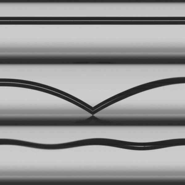 Traces of a moving particle shown as black lines against a gray background.