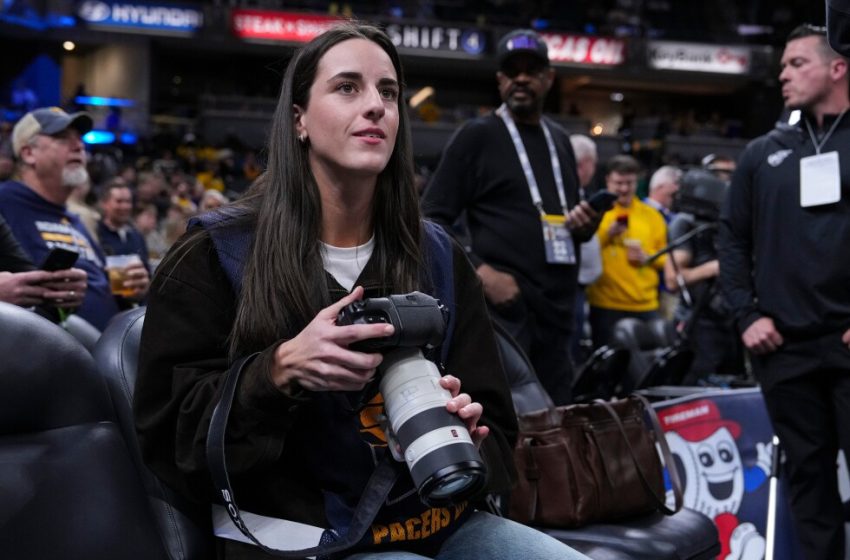  Caitlin Clark works as a photographer for Lakers-Pacers game