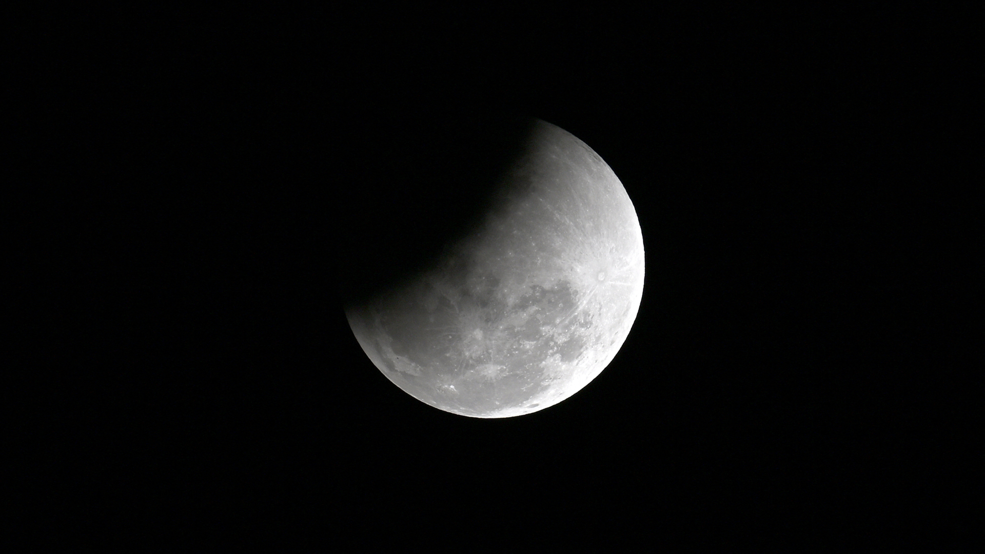 A full moon is pictured in a dark sky with its upper left disk obscured by the Earth's shadow during a lunar eclipse.Finally, Lauren DeCicca captured this gorgeous image of the uneclipsed lunar disk from Chiang Mai, Thailand on March 3.