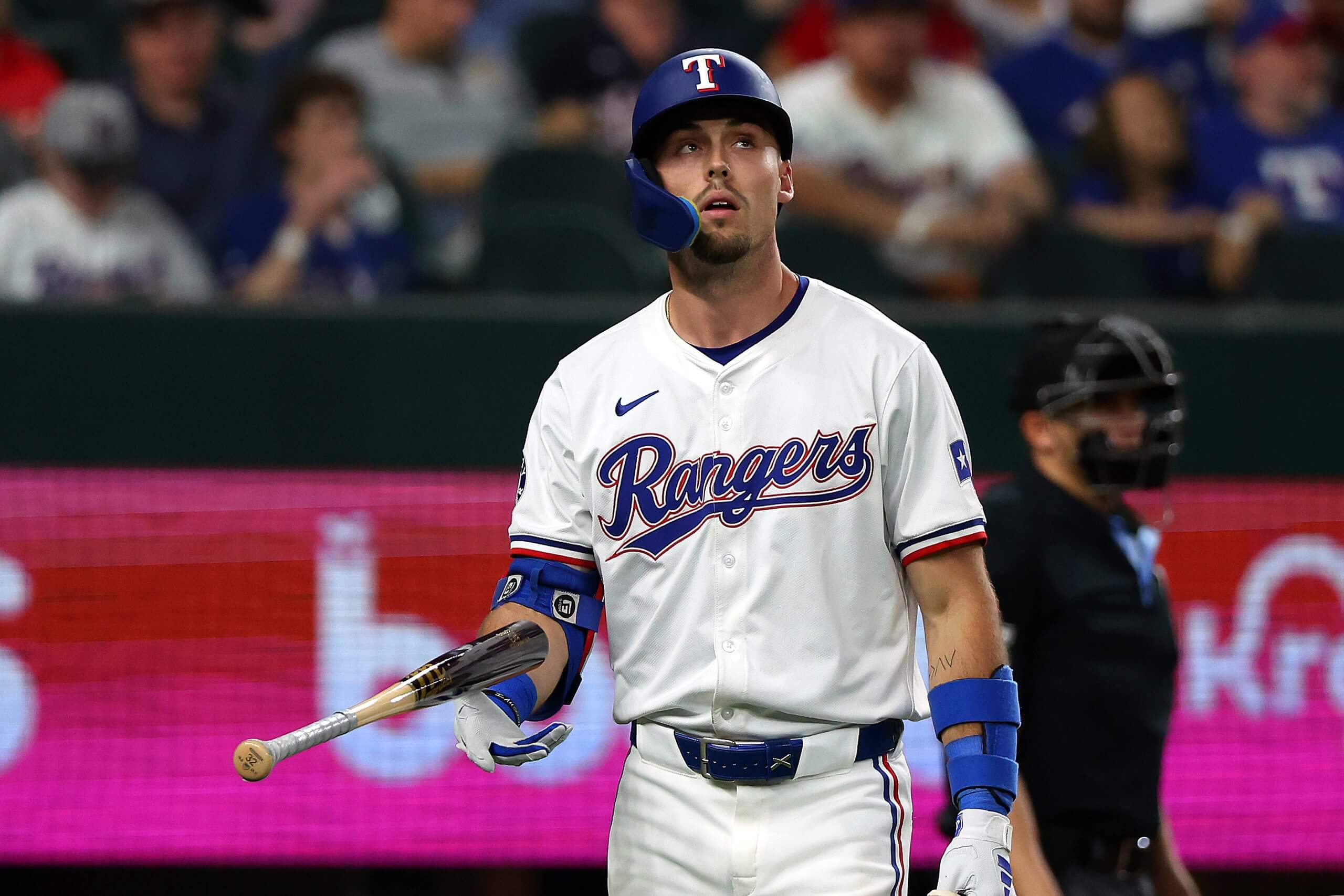 van Carter #32 of the Texas Rangers walks back to the dugout after striking out in the eighth inning against the Washington Nationals at Globe Life Field on May 01, 2024 in Arlington, Texas. 