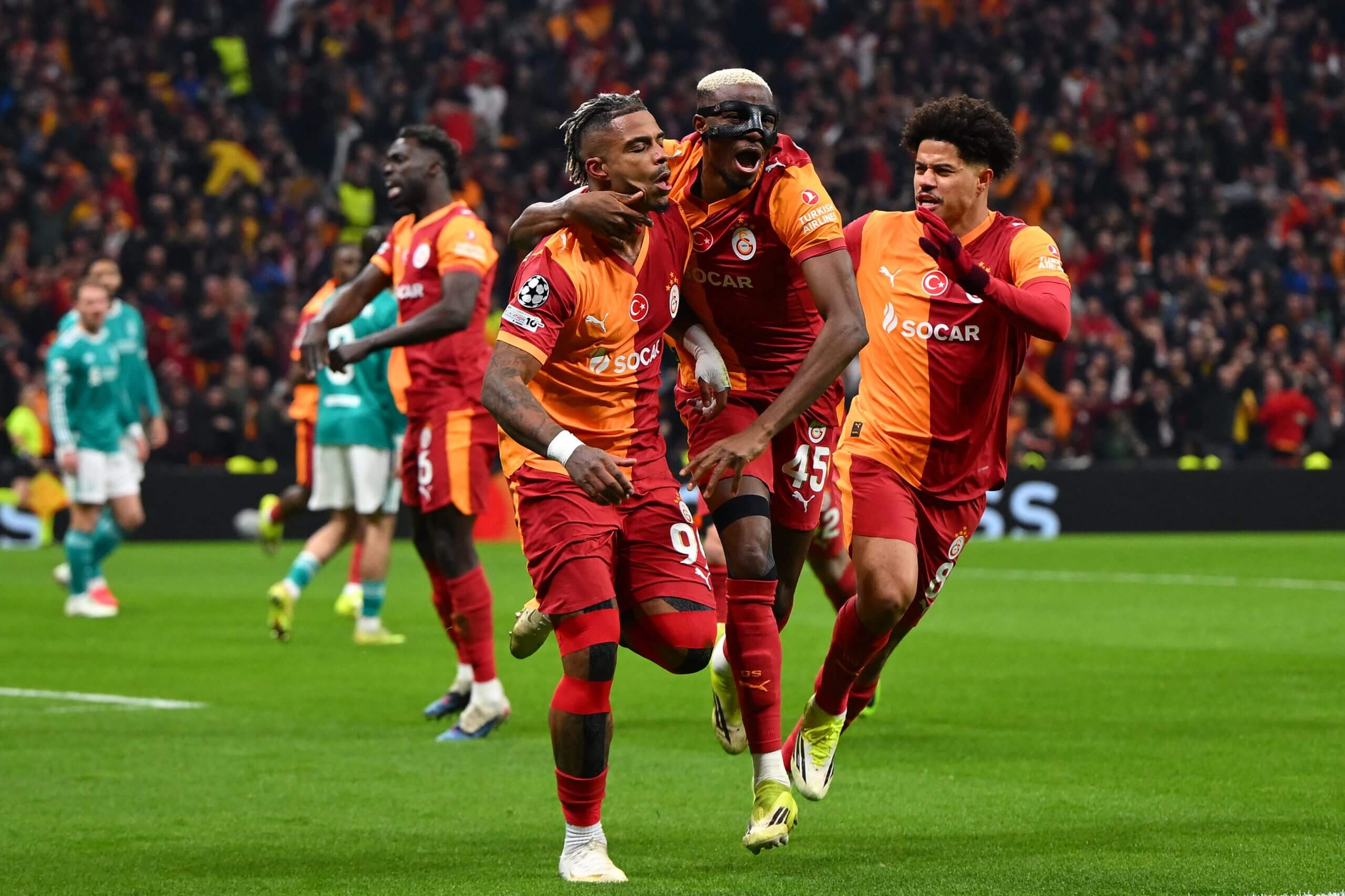 Mario Lemina and Victor Osimhen wheel away in celebration after Galatasaray open the scoring
