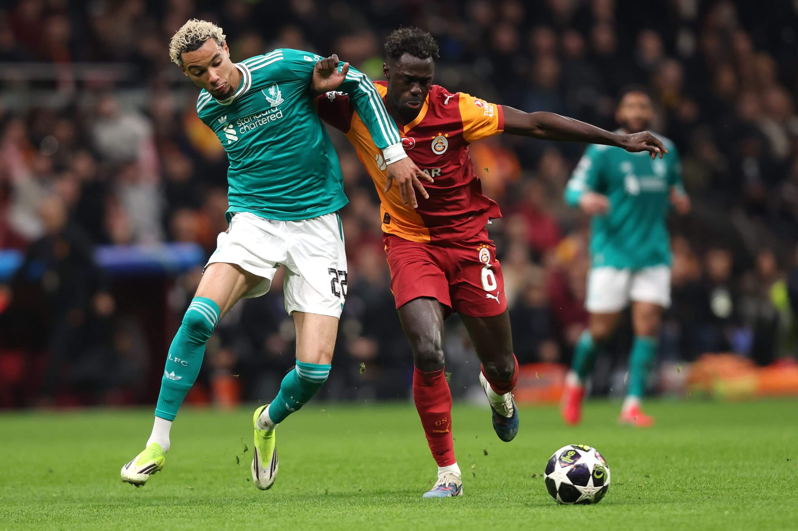 Hugo Ekitike tussles for possession with Davinson Sanchez