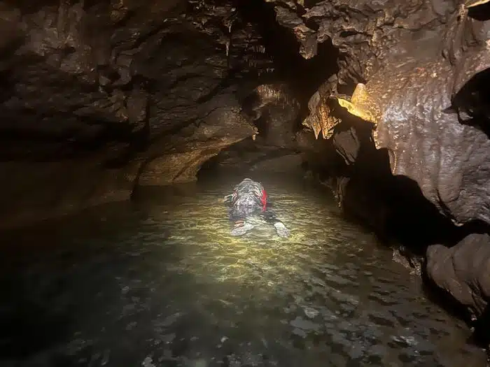 In The Dim Light Of Bender’s Cave, John Moretti Moves Through The Water, Searching For Traces Of A Prehistoric Past.