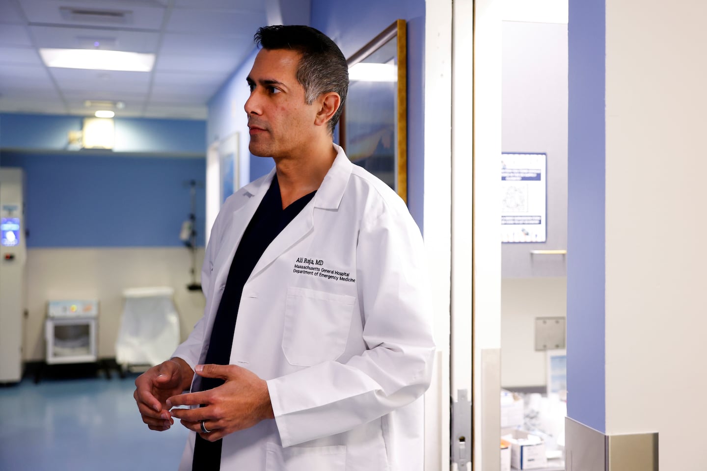 Dr. Ali Raja, vice chair of the emergency medicine department at Massachusetts General Hospital, talks to a colleague on Jan. 14.