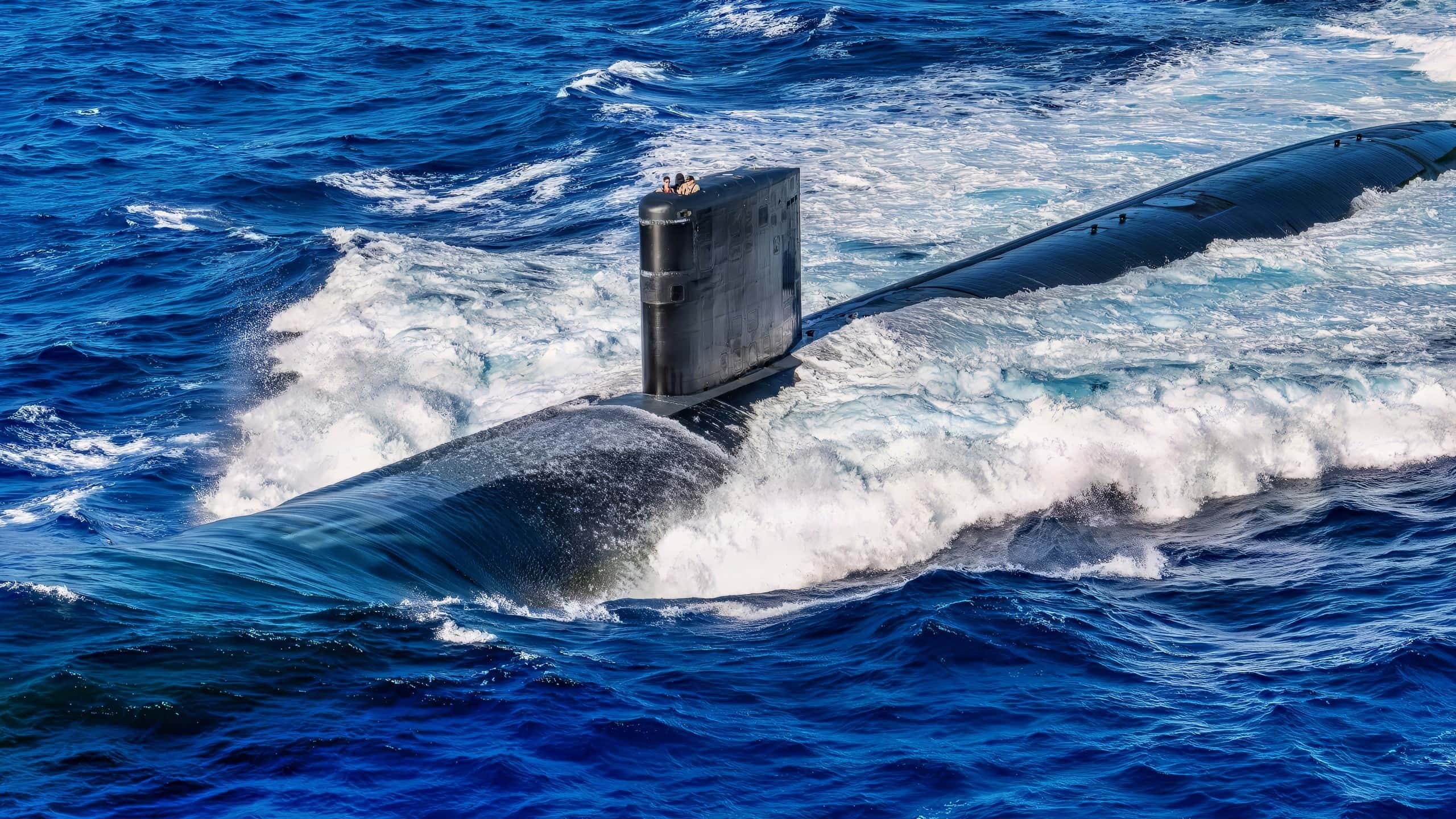 PACIFIC OCEAN (Dec. 17, 2025) - Los Angeles-class fast-attack submarine USS Annapolis (SSN 760) steams forward off the coast of Guam during a photo exercise, Dec. 17, 2025. Assigned to Commander, Submarine Squadron 15 at Polaris Point, Naval Base Guam, Annapolis is one of five fast-attack submarines forward-deployed in the Pacific. Renowned for their unparalleled speed, endurance, stealth, and mobility, fast-attack submarines serve as the backbone of the Navy's submarine force, ensuring readiness and agility in safeguarding maritime interests around the world. (U.S. Navy photo by Lt. James Caliva)