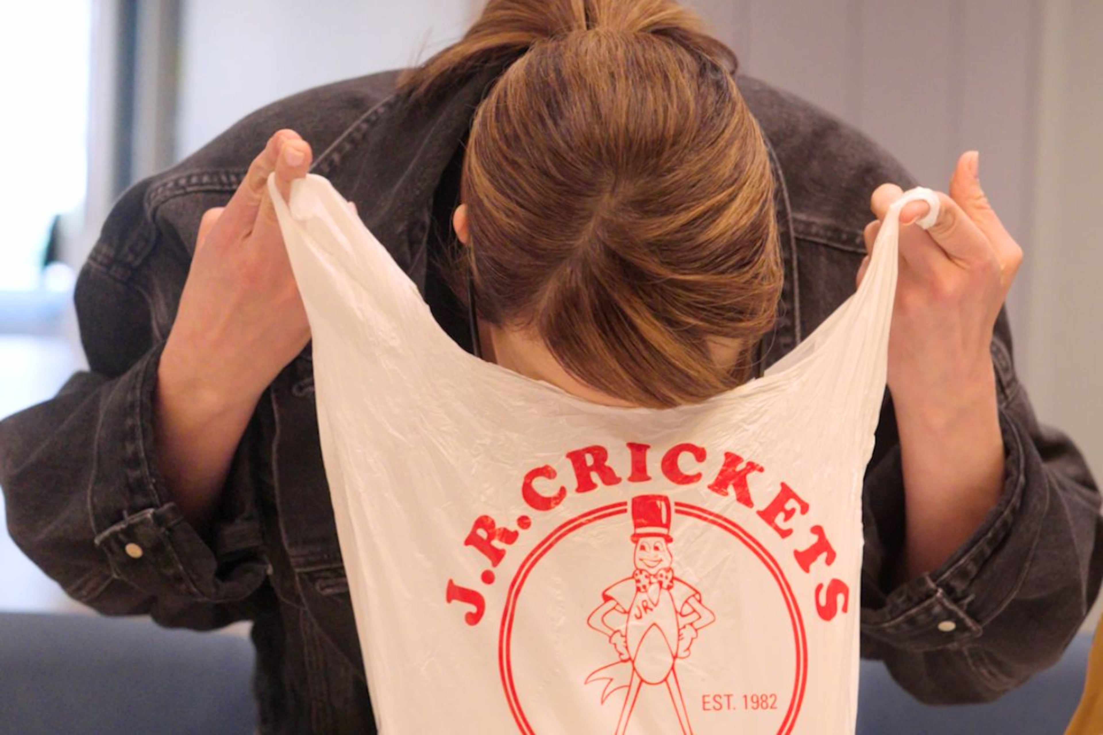 Monti Carlo leans in to catch the first hit of lemon pepper from J.R. Crickets during a blind taste testing at the AJC headquarters in Midtown on Friday, March 20, 2026. (Matt Gannon/AJC)