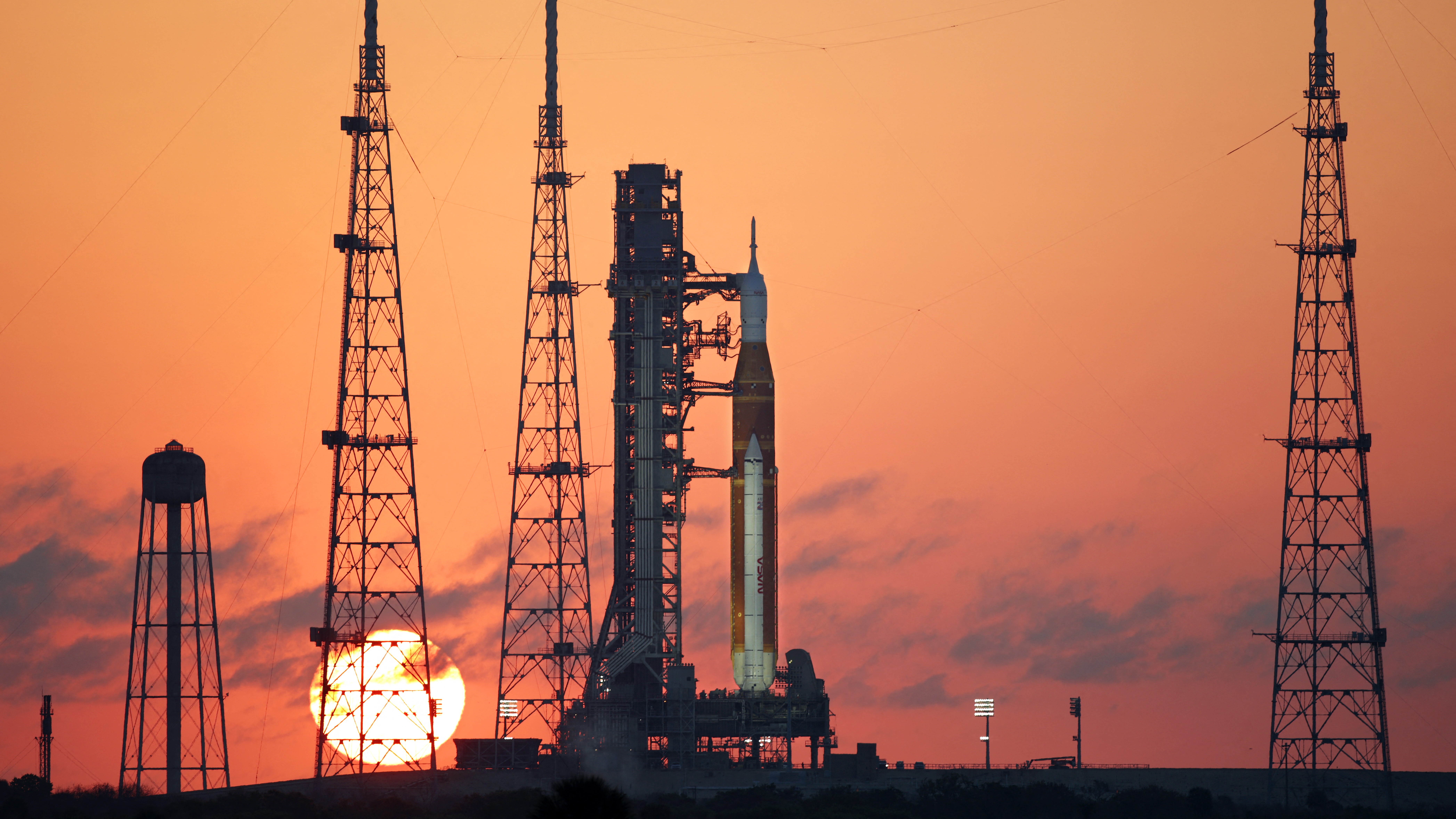The Artemis II rocket on a launch pad at the Kennedy Space Center in Florida at sunrise.