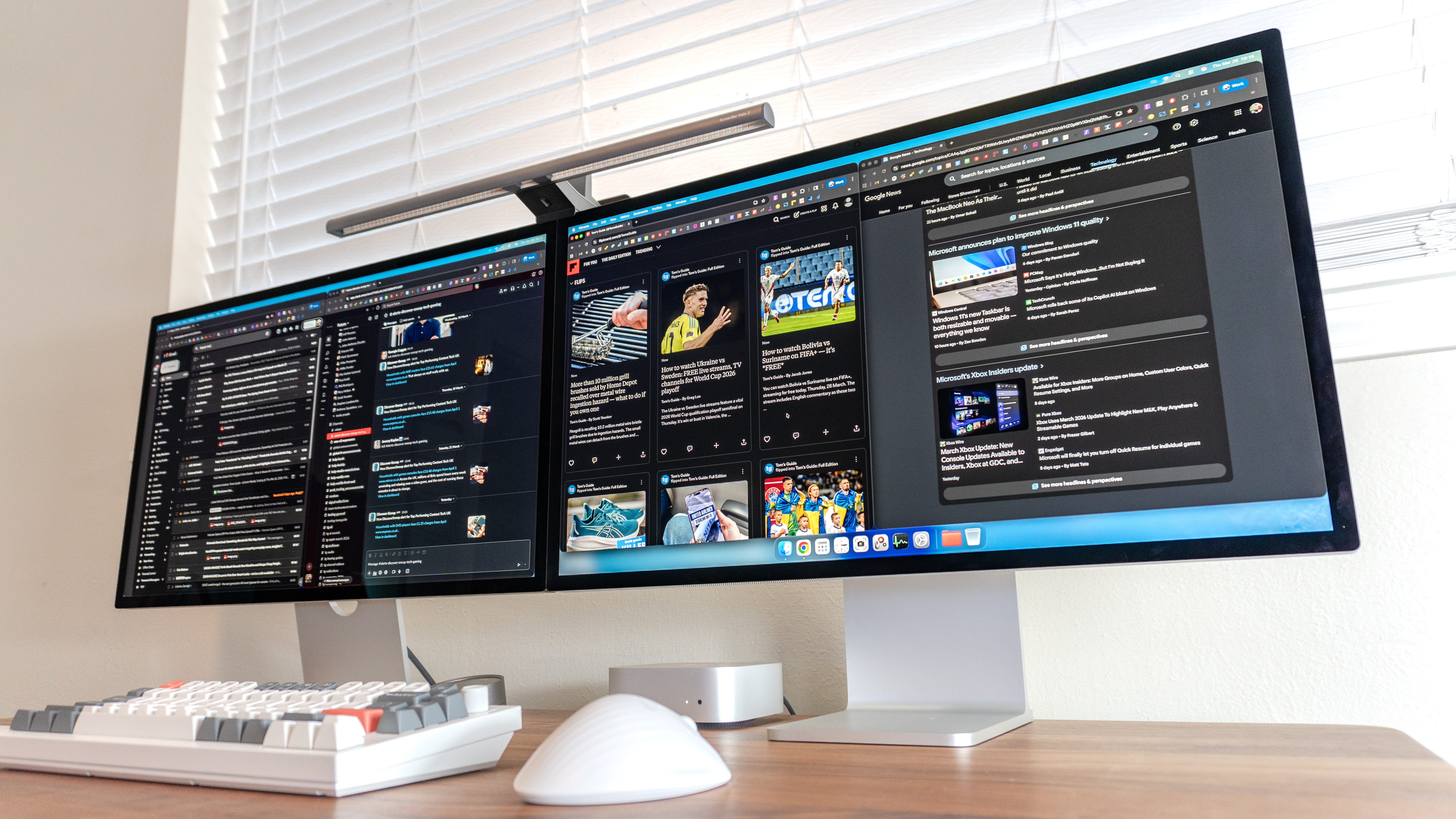 Working on side by side Apple Studio Display monitors with two Chrome windows open on each device