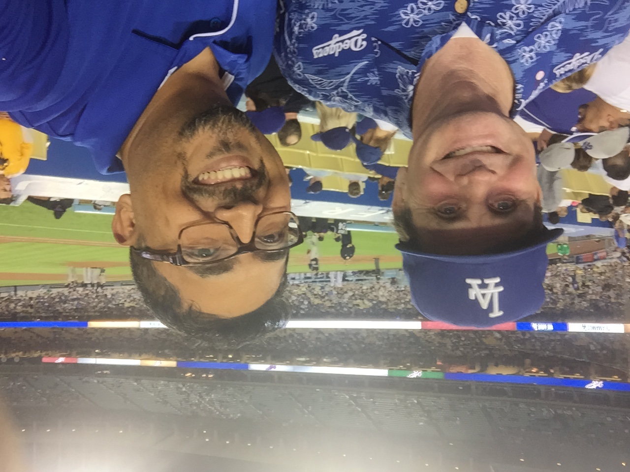 Two men taking a selfie at a Dodgers game