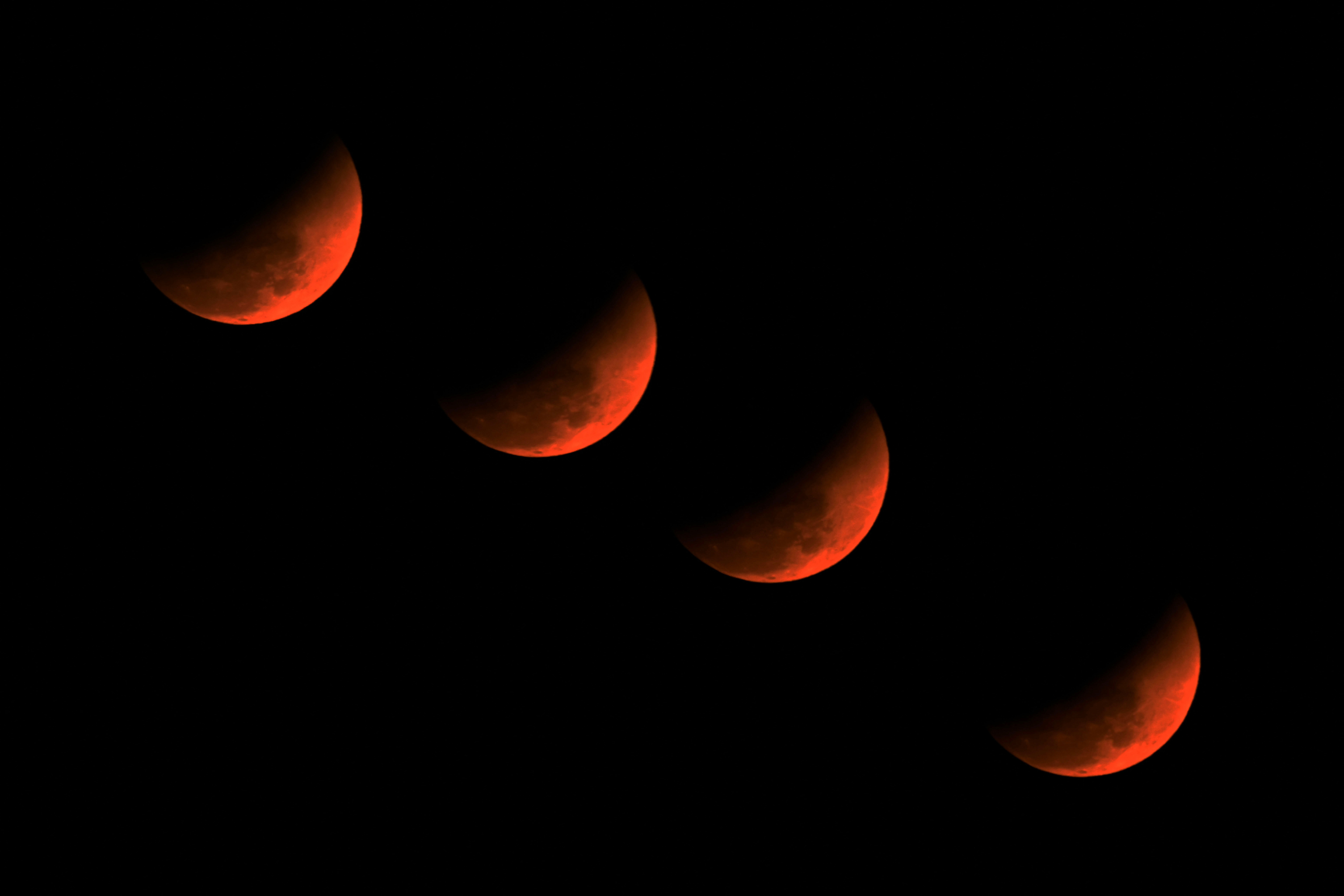 A multiple exposure picture of the ‘blood moon’ over Golaghat in Assam, India.