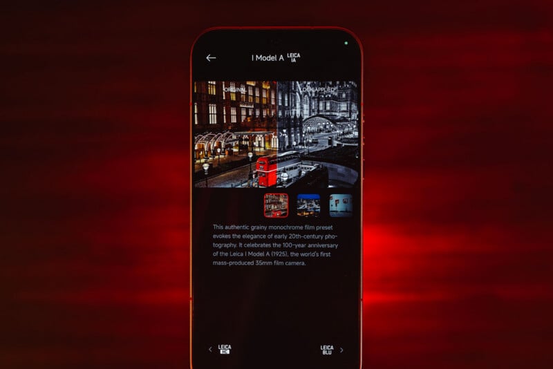 A smartphone screen displays a black-and-white photo of a city street with a red double-decker bus, viewed against a red background. Text below describes the Leica I Model A, the first mass-produced 35mm film camera.