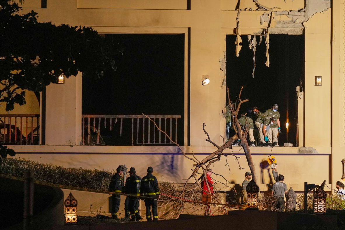 Emergency workers inspect damage to the Fairmont The Palm hotel in Dubai, United Arab Emirates.