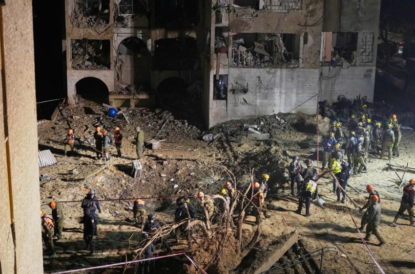  2 Iranian strikes on towns near Israel’s main nuclear research center injure more than 100 people