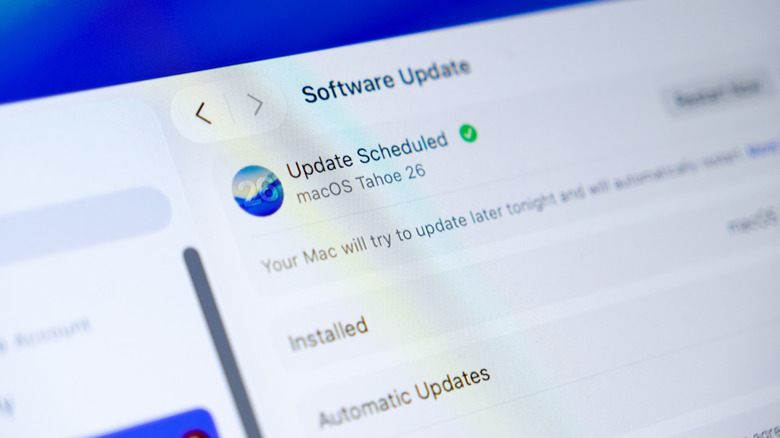 macOS Tahoe webpage displayed on a laptop computer screen