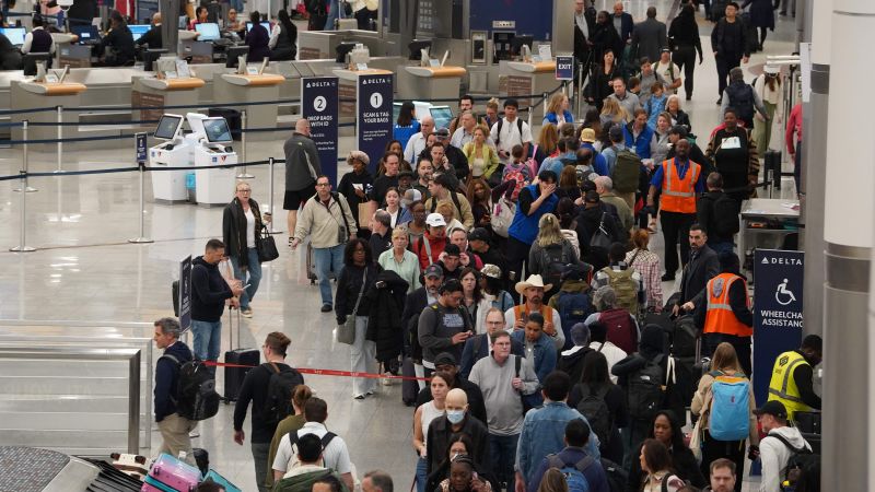  Travelers face unpredictable airport wait times as TSA officers go unpaid – CNN