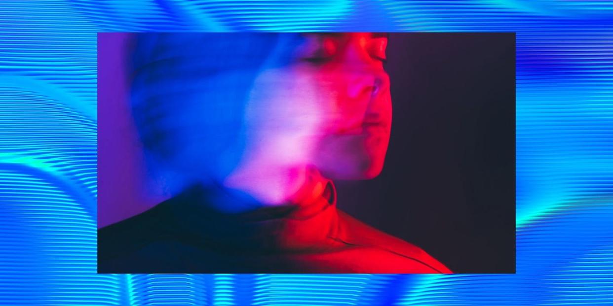 a blurred portrait with vibrant colors and abstract background