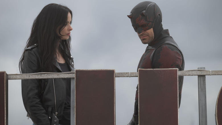 Krysten Ritter as Jessica Jones standing opposite Charlie Cox as Matt Murdock/Daredevil in Daredevil: Born Again season 2