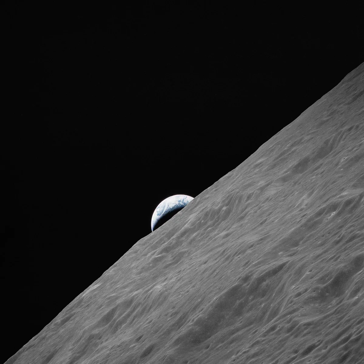 The crescent Earth appears above the surface of the Moon in this image captured by the Apollo 17 during their mission, 7–19 December 1972. Apollo 17 was the final mission of the Apollo programme, and the most recent mission to set human feet on the lunar surface. Credit: NASA