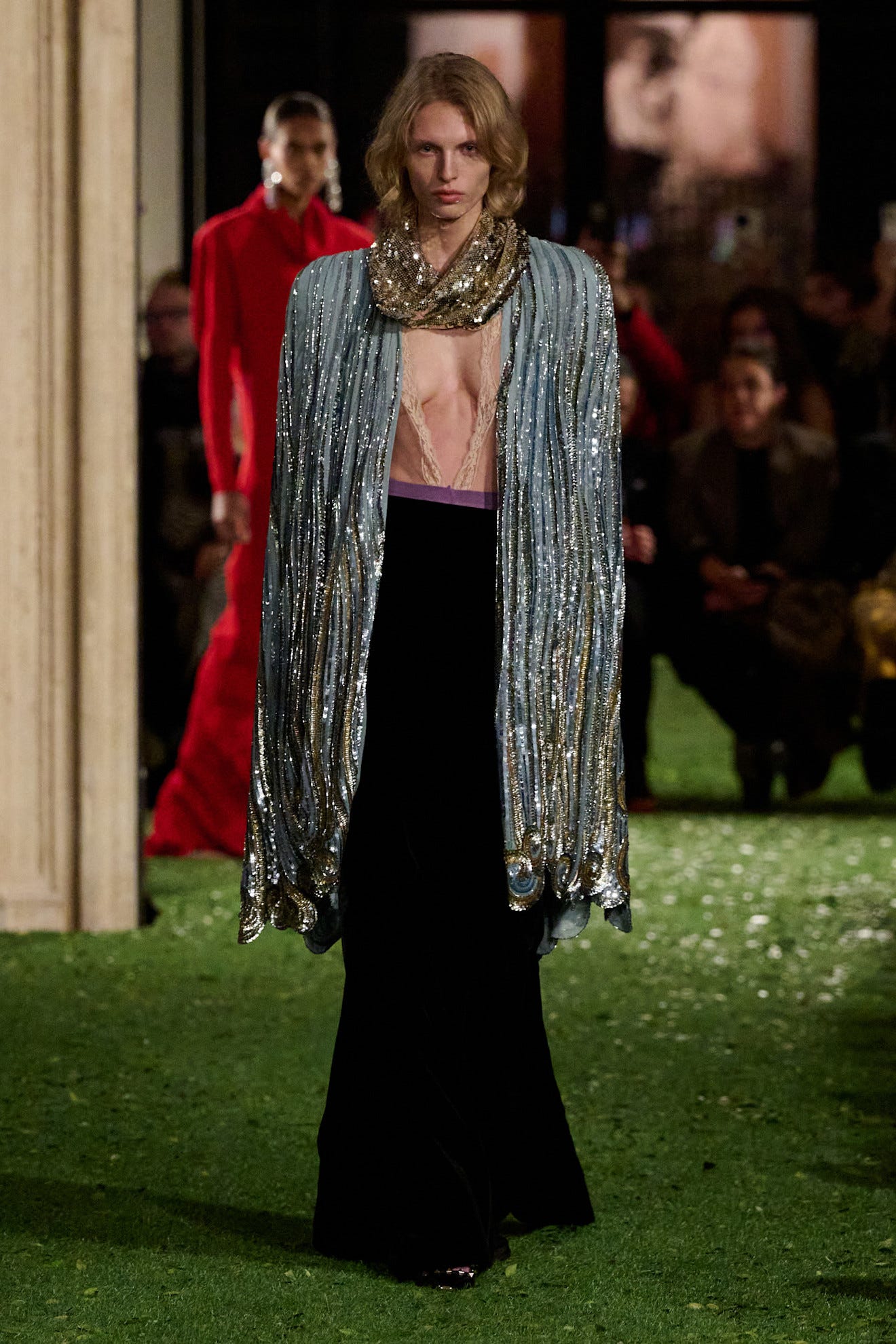 fashion model showcasing a striking outfit on a runway