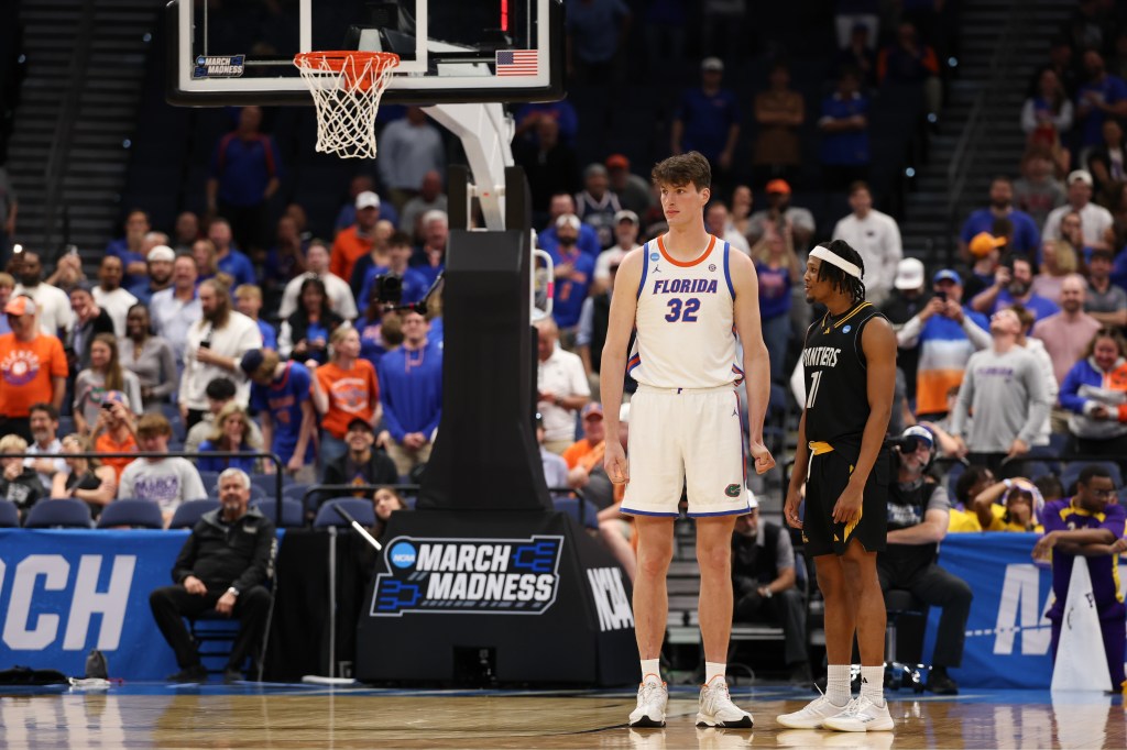 Florida Gators center Olivier Rioux and Prairie View A&M Panthers forward Hassane Diallo on the court during a March Madness game.