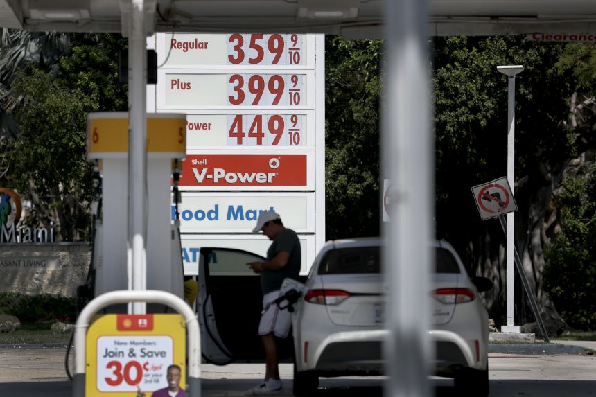 The price per gallon of gas is shown on a sign as a customer gets fuel at a station on March 09, 2026, in Miami, Florida. A barrel of oil passed the $100 mark for the first time in four years since Russia invaded Ukraine.