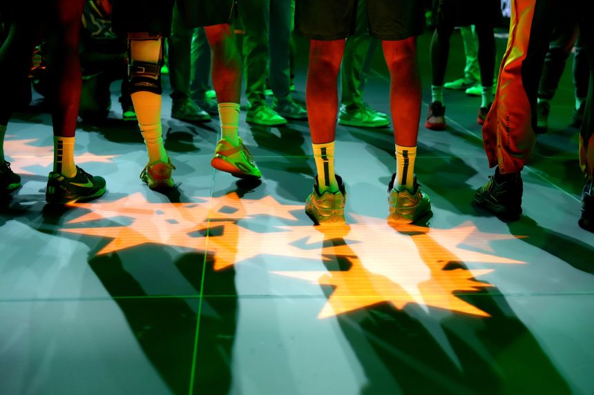 The LED court illuminates the shoes of Baylor players at a first-round game on Tuesday.
