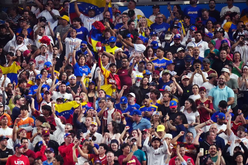 Fans are seen cheering during the 2026 World Baseball Classic semifinal between Team Venezuela and Team Italy on Monday.