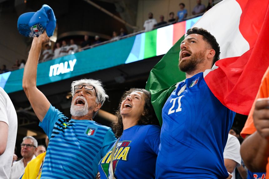 Italy fans cheer in Miami while watching the team take on Venezuela in the semifinals.