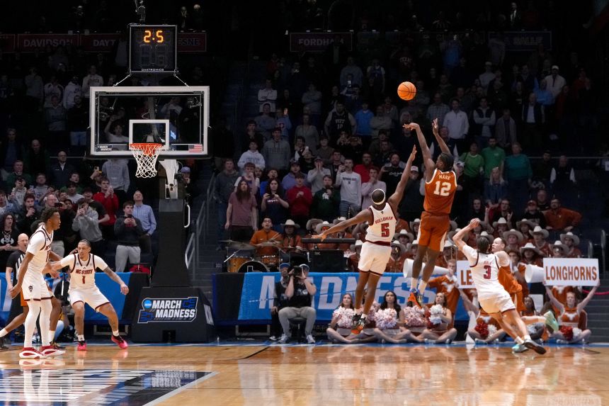 Tramon Mark hits a last-second shot to lift Texas past North Carolina State on Tuesday.