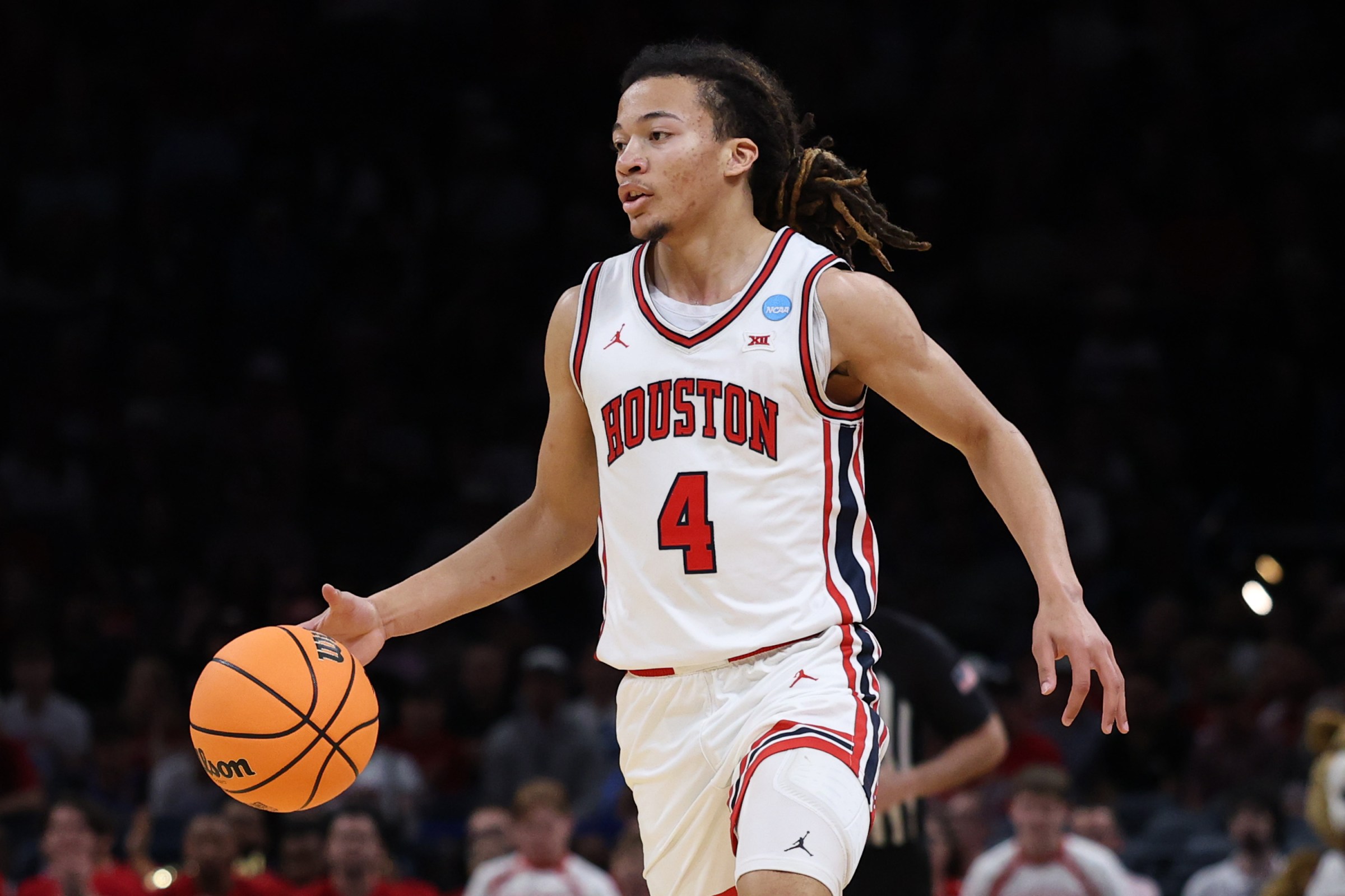 OKLAHOMA CITY, OKLAHOMA - MARCH 19: Kingston Flemings #4 of the Houston Cougars dribbles the ball against the Idaho Vandals during the first half in the first round of the 2026 NCAA Men’s Basketball Tournament at Paycom Center on March 19, 2026 in Oklahoma City, Oklahoma. (Photo by Stacy Revere/Getty Images)