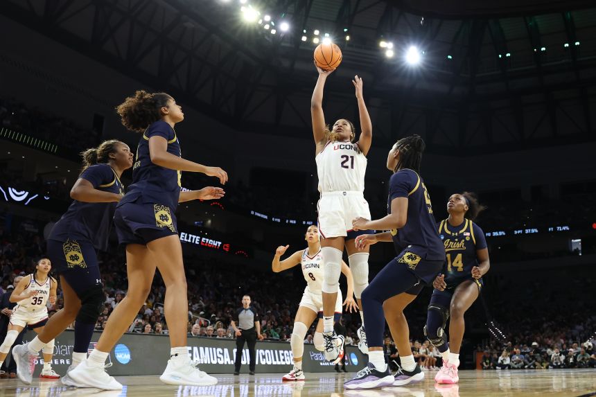 Sarah Strong #21 of the UConn Huskies takes a shot against the Notre Dame Fighting Irish during the third quarter.