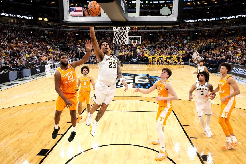 Yaxel Lendeborg of the Michigan Wolverines weaves through the defense for a lay-up in an Elite Eight win over Tennessee.