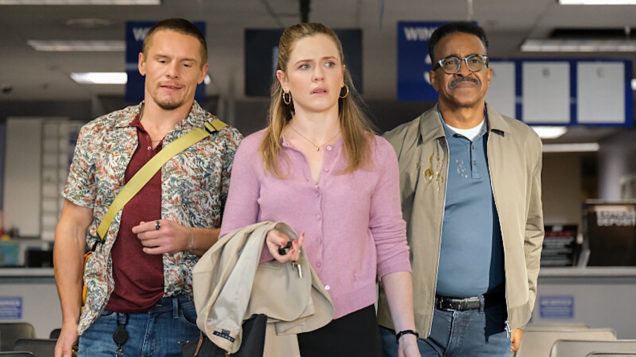 Pictured (L-R): Tony Cavalero as Vic, Harriet Dyer as Colette, and Tim Meadows as Gregg standing together in DMV