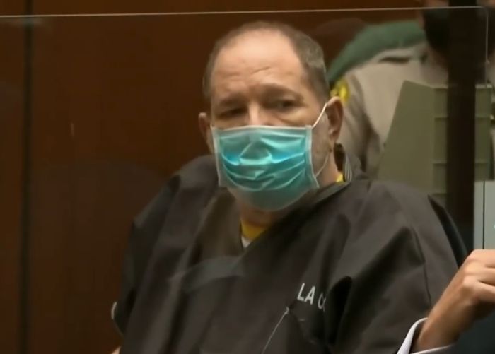 Harvey Weinstein in court wearing a mask and prison attire amid controversy involving Gwyneth Paltrow.
