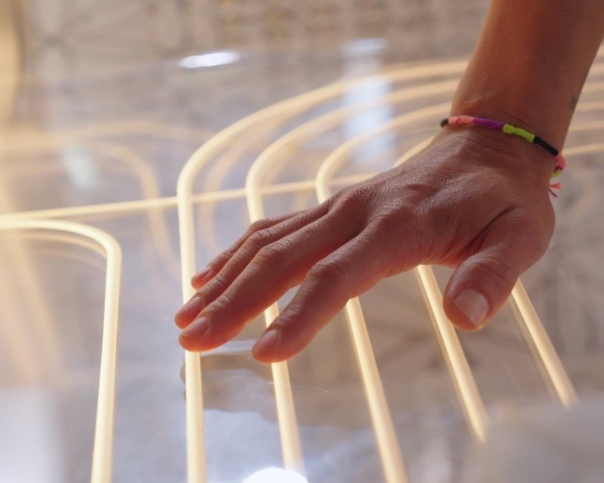 a hand resting on the ammortal chamber electric coils