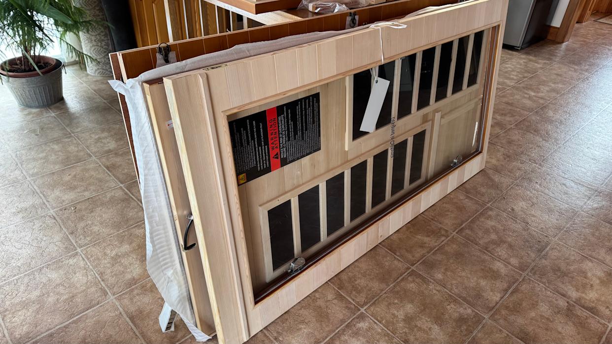 The package was too heavy to move, so we carried each panel inside one at a time.