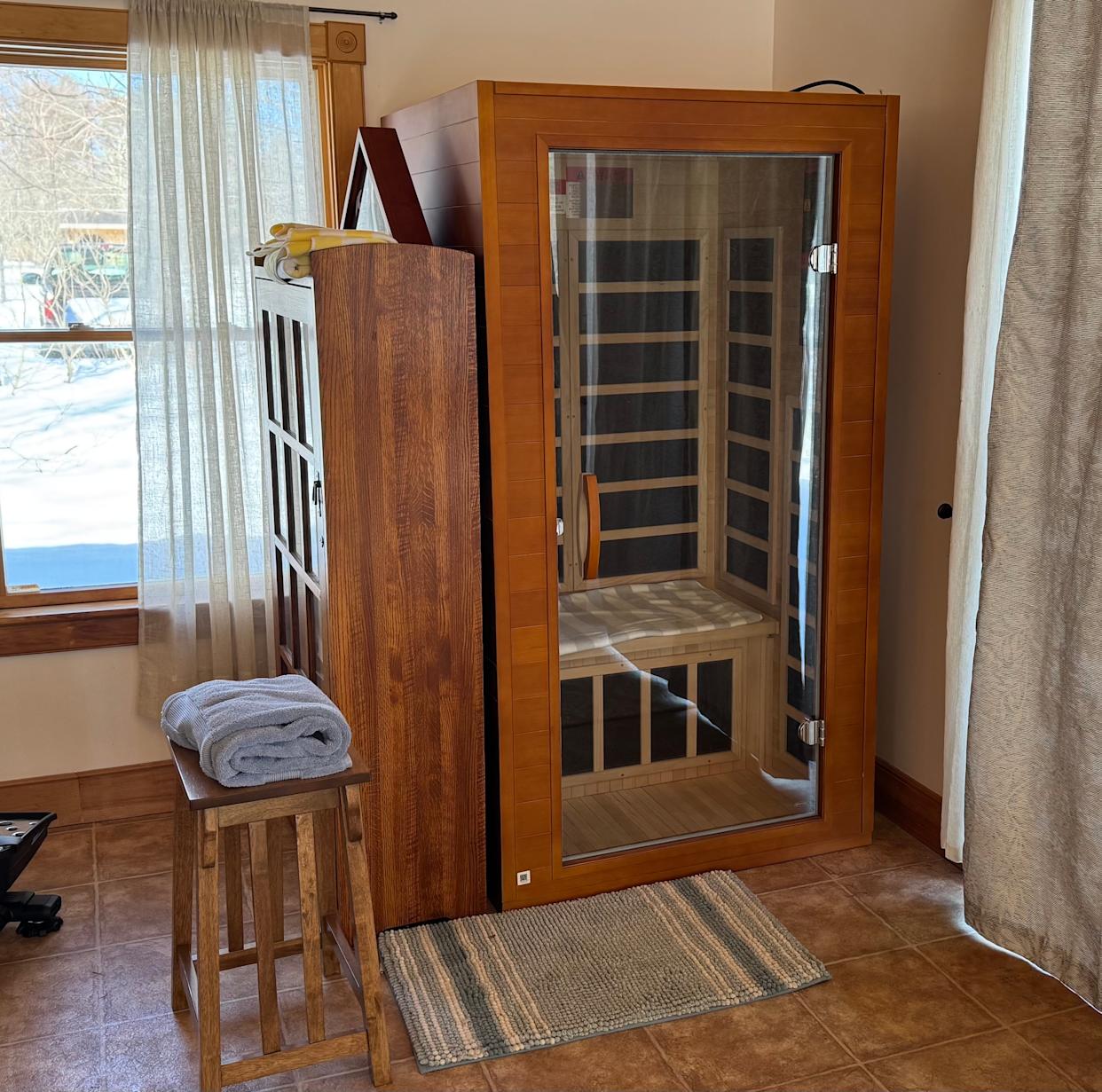 The infrared sauna is a stylish addition to our exercise space.