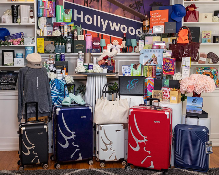 Oscars gift bag contents with luxury suitcases, designer items, and exclusive high-end products for nominees.