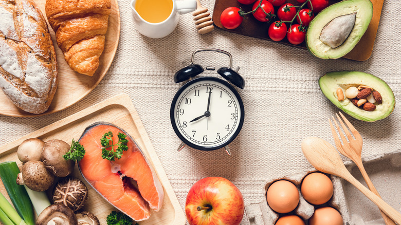 Whole food groups surrounding analog clock