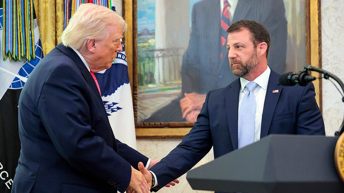 Mullin and Trump shake